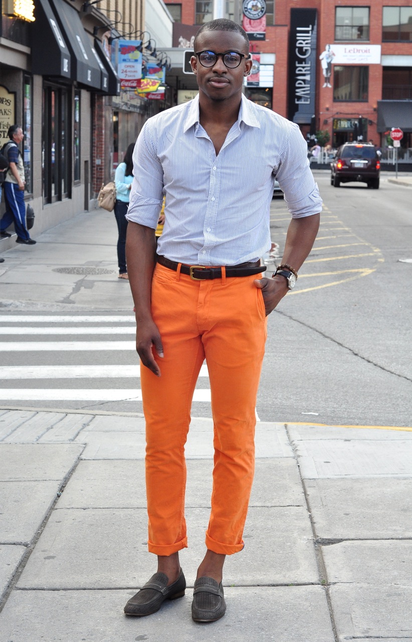 mens orange pants, mens orange pants street style, pinstripe shirt, GQ, mens horn rimmed glasses, handsome black man